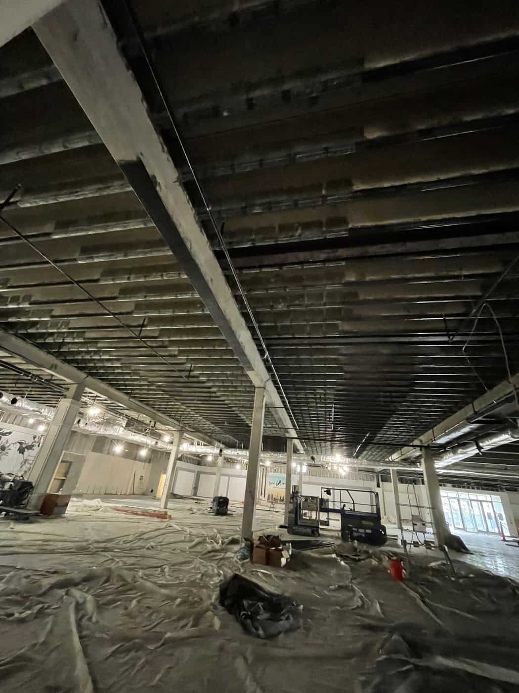 Wide view of a concrete joist ceiling with carbon fiber bands and girders.